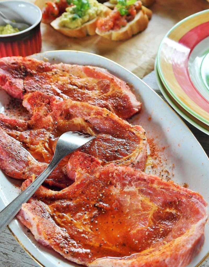 pork chops with marinade on them