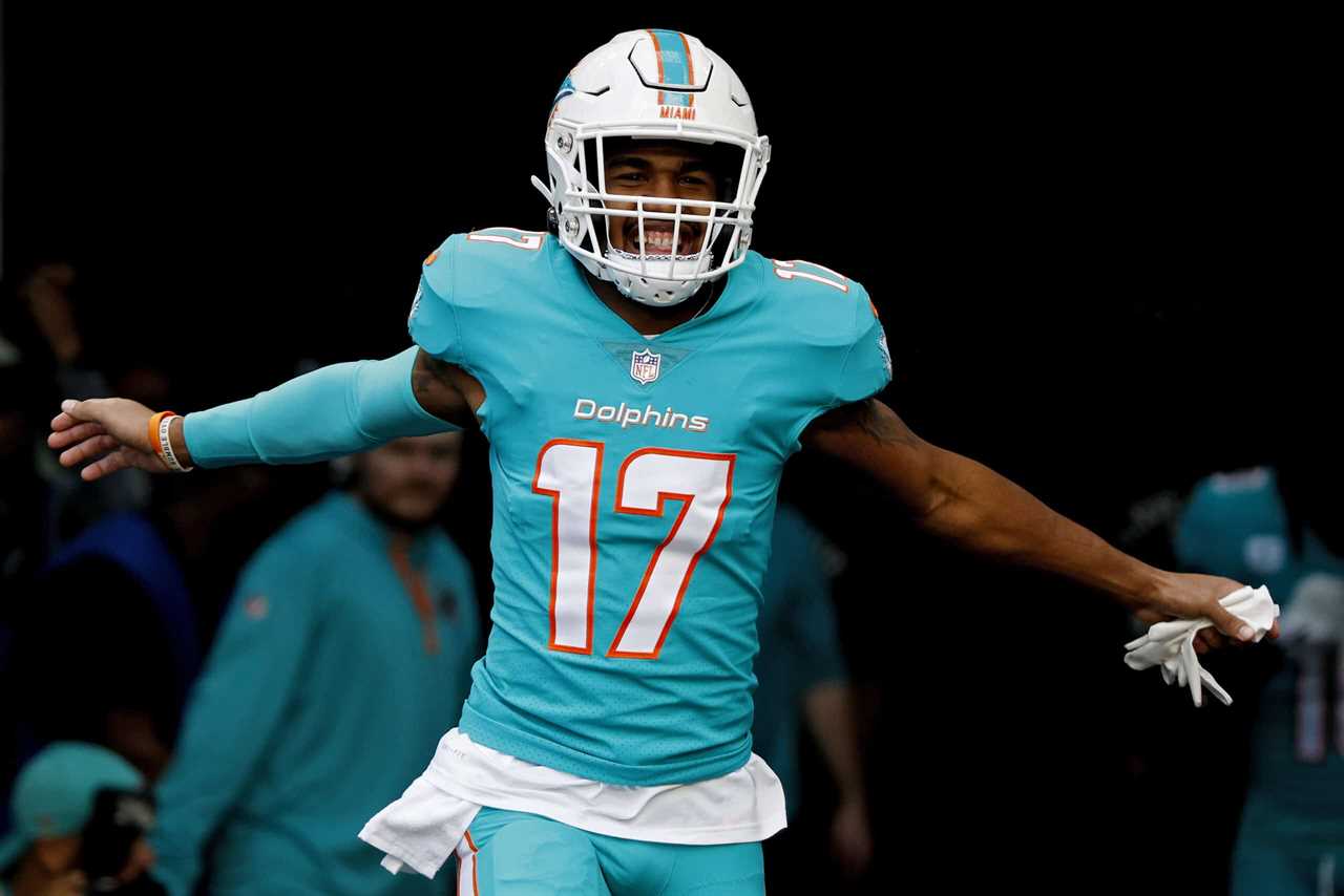 Jaylen Waddle #17 of the Miami Dolphins runs onto field prior to a game against the New York Jets at Hard Rock Stadium on January 08, 2023 in Miami Gardens, Florida.