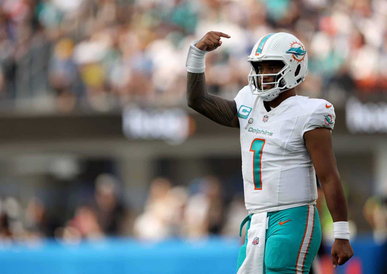 Tua Tagovailoa #1 of the Miami Dolphins signals as he returns to the field during a 36-34 Dolphins win over the Los Angeles Chargers at SoFi Stadium on September 10, 2023 in Inglewood, California.