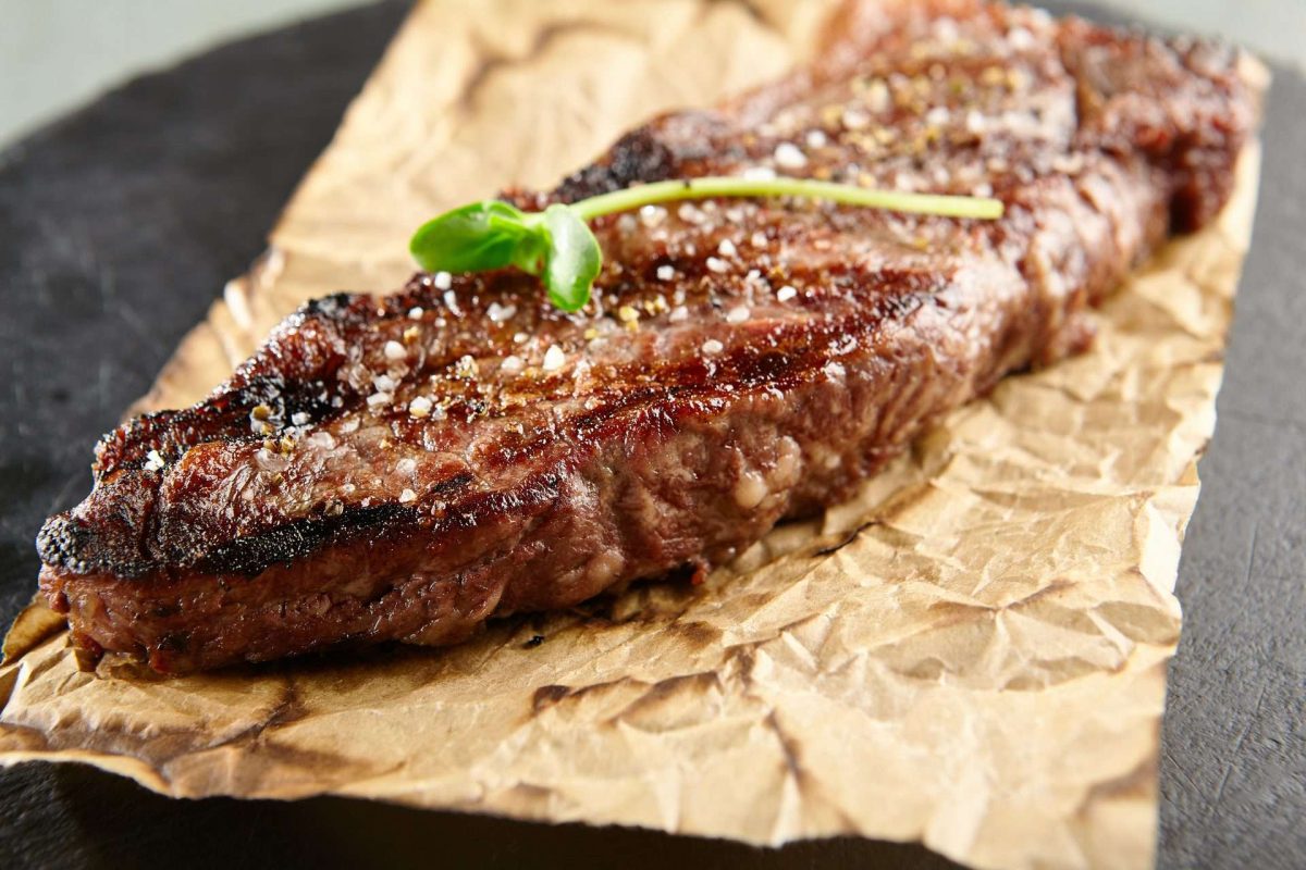 Pastrami style steak on brown paper