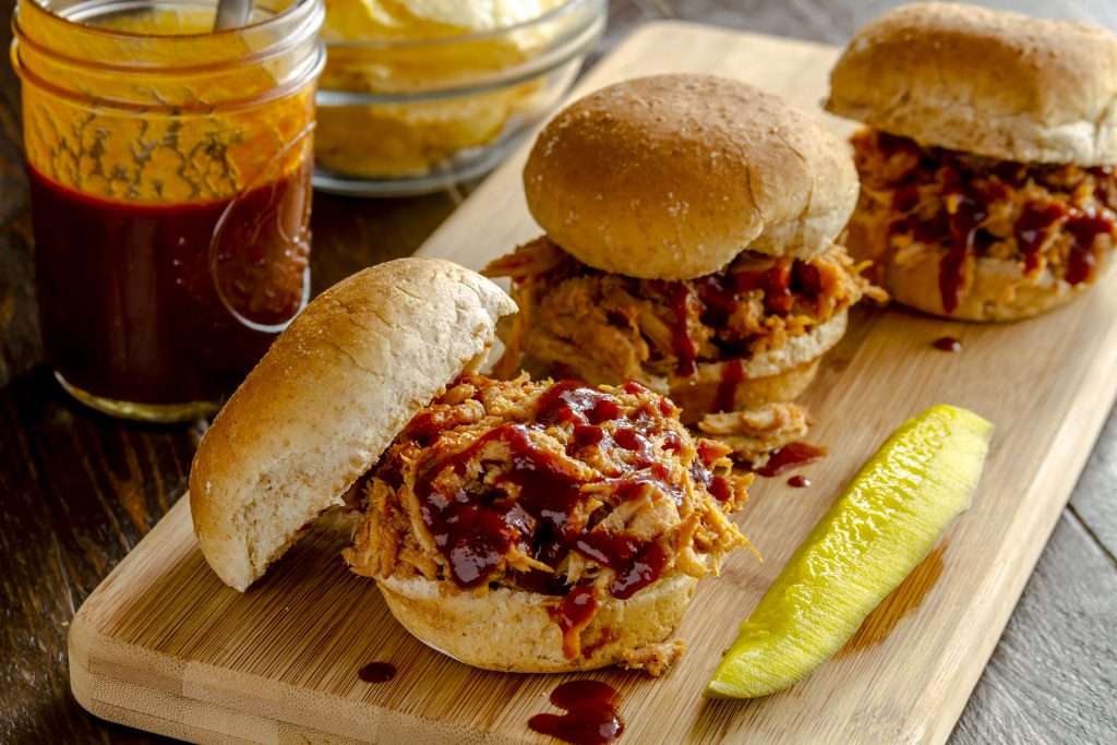 Poulled pork table sauce on pulled pork sandwiches