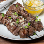 grilled sirloin tip bites on a white plate
