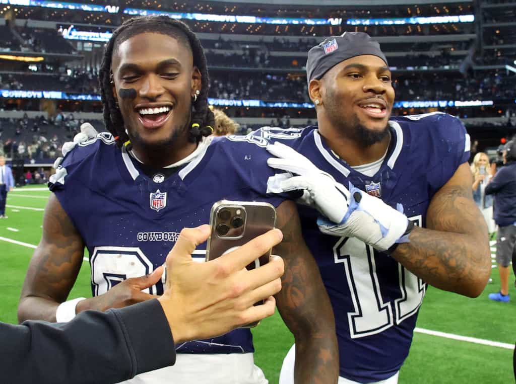 CeeDee Lamb #88 and Micah Parsons #11 of the Dallas Cowboys celebrate after the win over the Los Angeles Rams at AT&T Stadium on October 29, 2023 in Arlington, Texas.