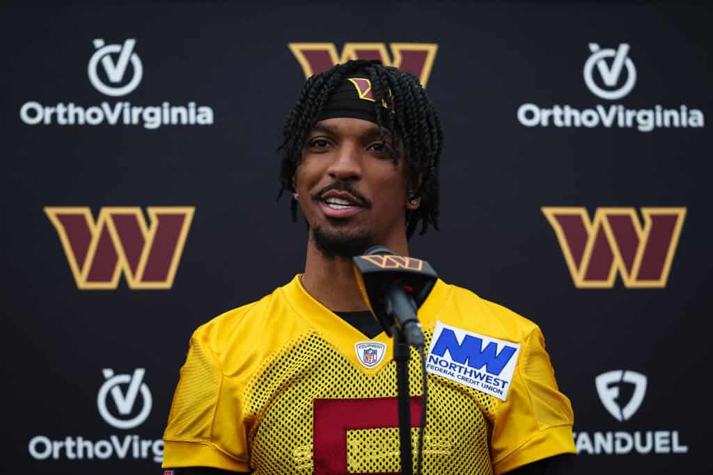 Jayden Daniels #5 of the Washington Commanders speaks with the media during Washington Commanders Rookie Minicamp at OrthoVirginia Training Center on May 10, 2024 in Ashburn, Virginia.