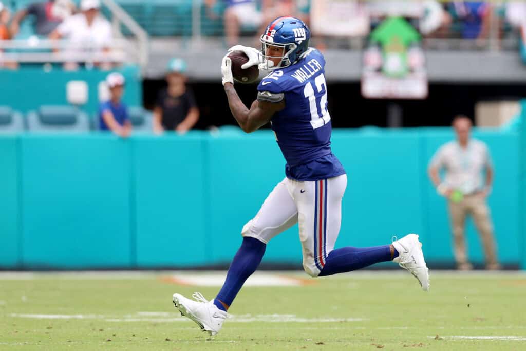 MIAMI GARDENS, FLORIDA - OCTOBER 08: Darren Waller #12 of the New York Giants makes a catch against the Miami Dolphins during the second half at Hard Rock Stadium on October 08, 2023 in Miami Gardens, Florida.