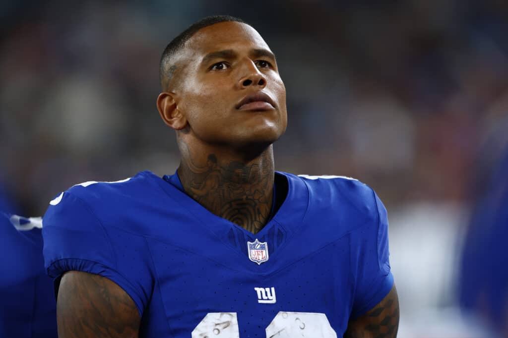 Darren Waller #12 of the New York Giants on the sidelines during a pre-season football game against the Carolina Panthers at MetLife Stadium on August 18, 2023 in East Rutherford, New Jersey.
