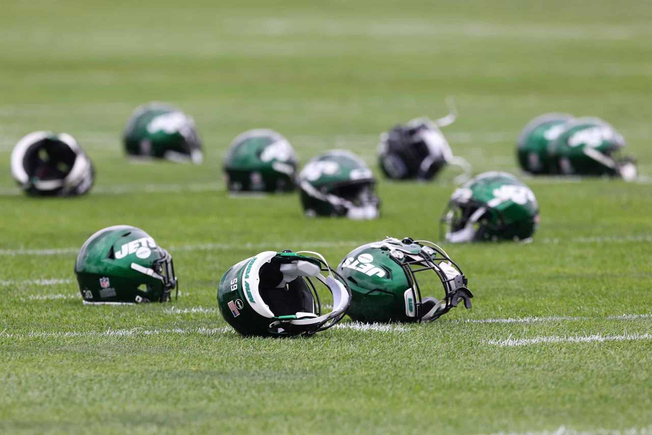 New York Jets helmets lie on the field during a morning practice at Atlantic Health Jets Training Center on July 29, 2021 in Florham Park, New Jersey.