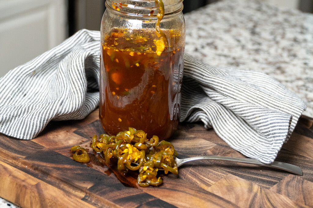 a full jar of cowboy candy and a spoonful of cowboy candy