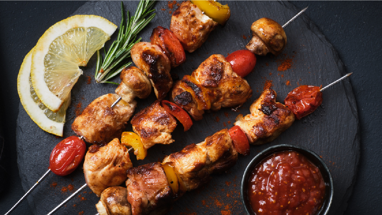 Grilling BBQ Chicken with Skewers