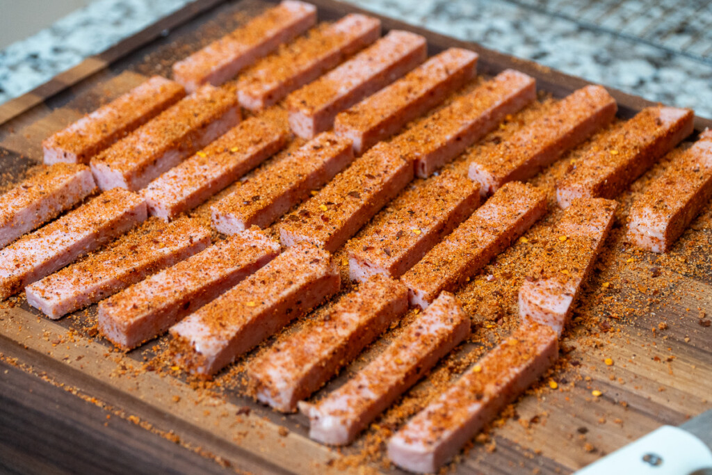 seasoned spam fries on a wooden board