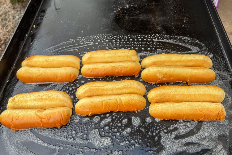 buns being toasted on a griddle