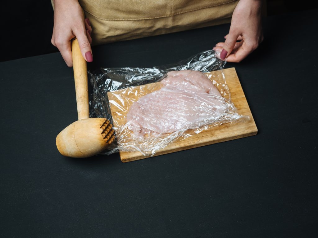 flattening chicken breasts with kitchen mallet