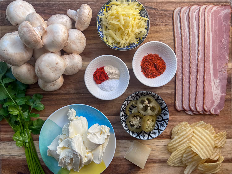 mushroom jalapeno popper ingredients laid out on a wooden board