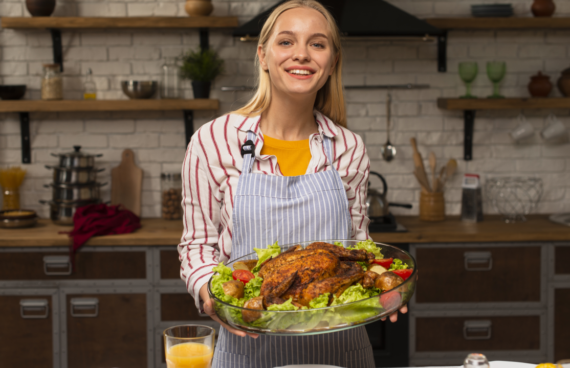 woman serving oven roasted whole chicken to her family