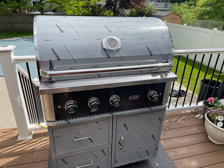 Wildfire Ranch Pro 36” gas grill in protective cover