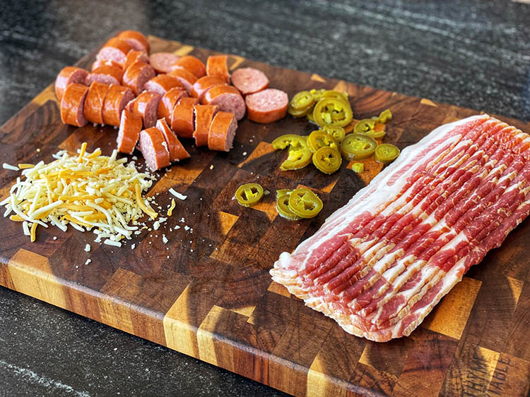 smoked pig shot ingredients on a wooden chopping board