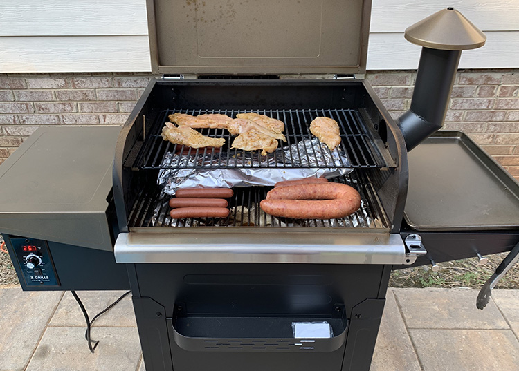 Different meats cooking on a Z Grills L6002B pellet grill