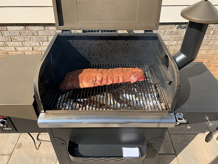 Meat cooking on a Z Grills L6002B