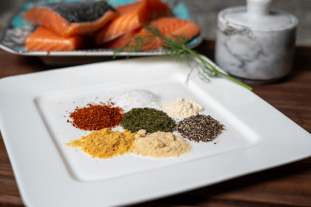 ingredients for salmon seasoning on a white plate