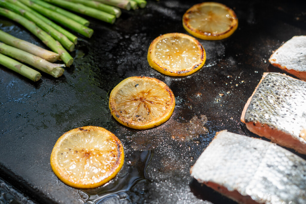 charred lemon slices on the griddle