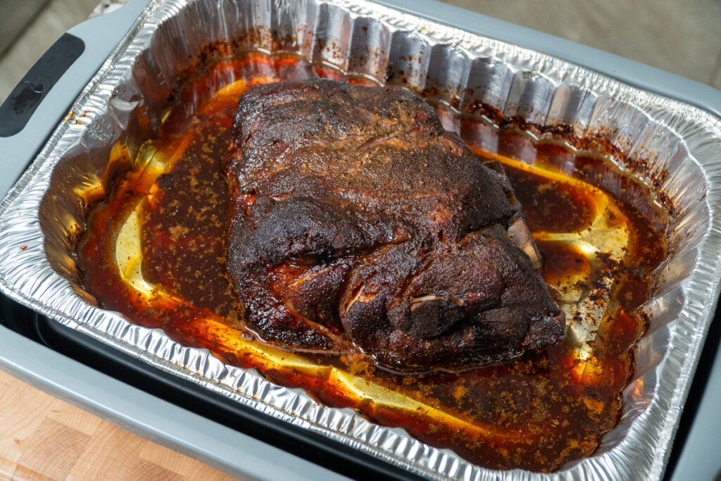 whole piece of smoked pork butt before shredding