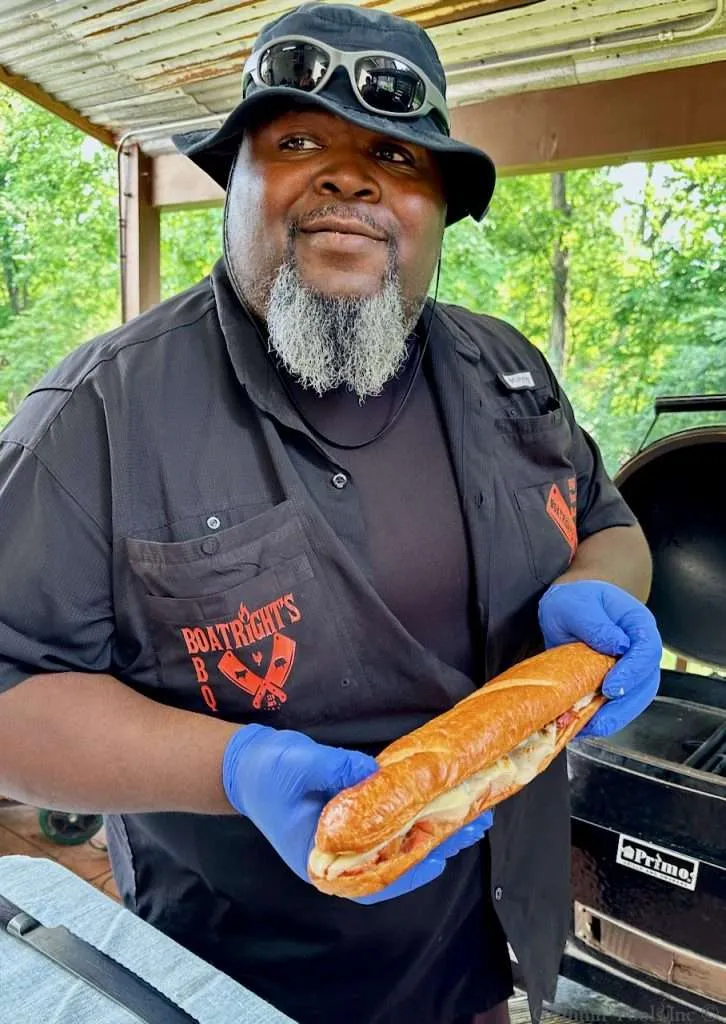 James Boatright holding a sandwich