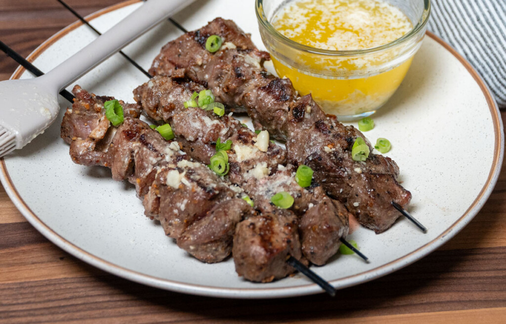 grilled sirloin tip bites on a white plate