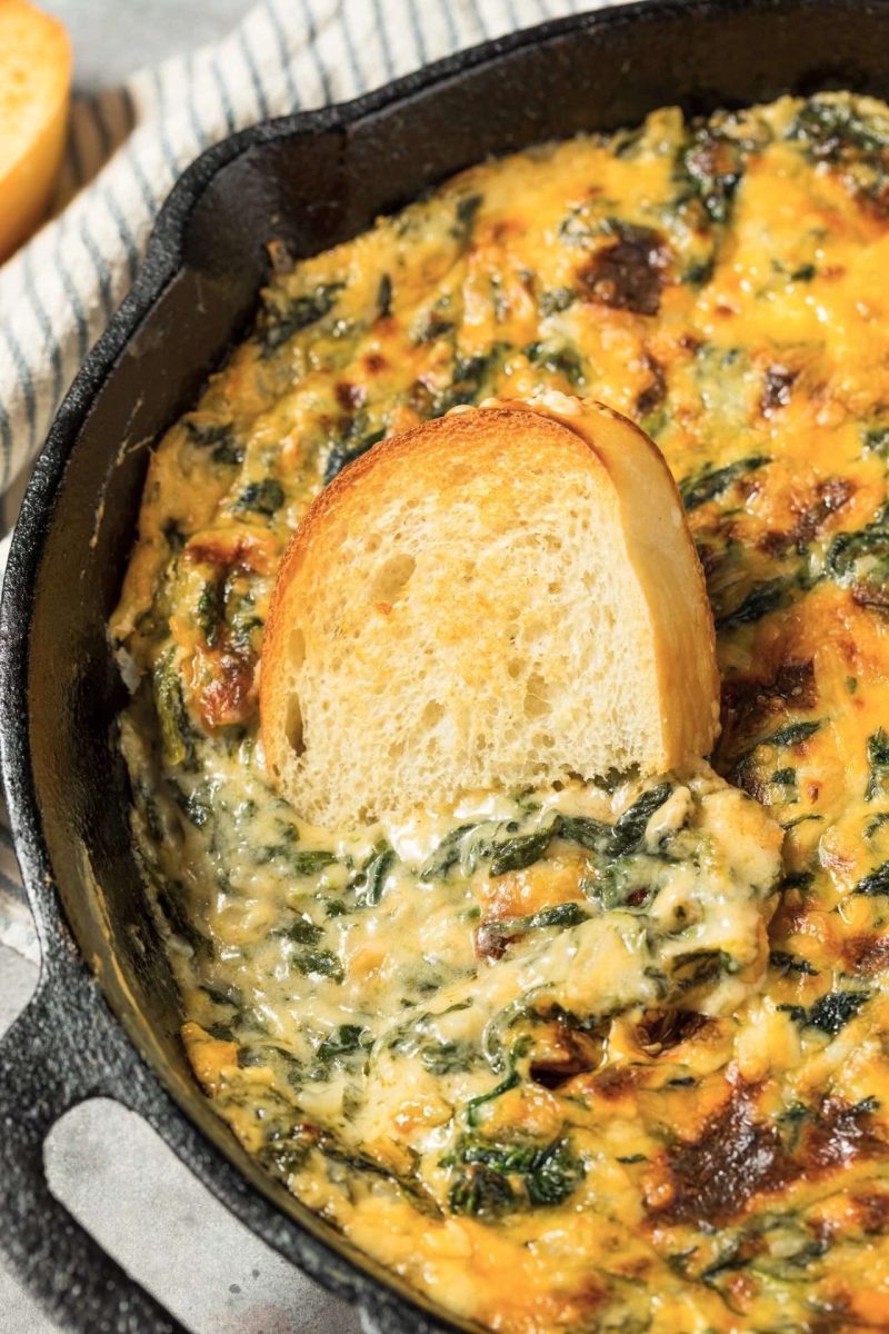 smoked spinach artichoke dip in cast-iron skillet.