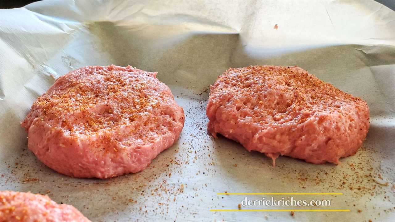 Raw turkey patties with BBQ rub on top