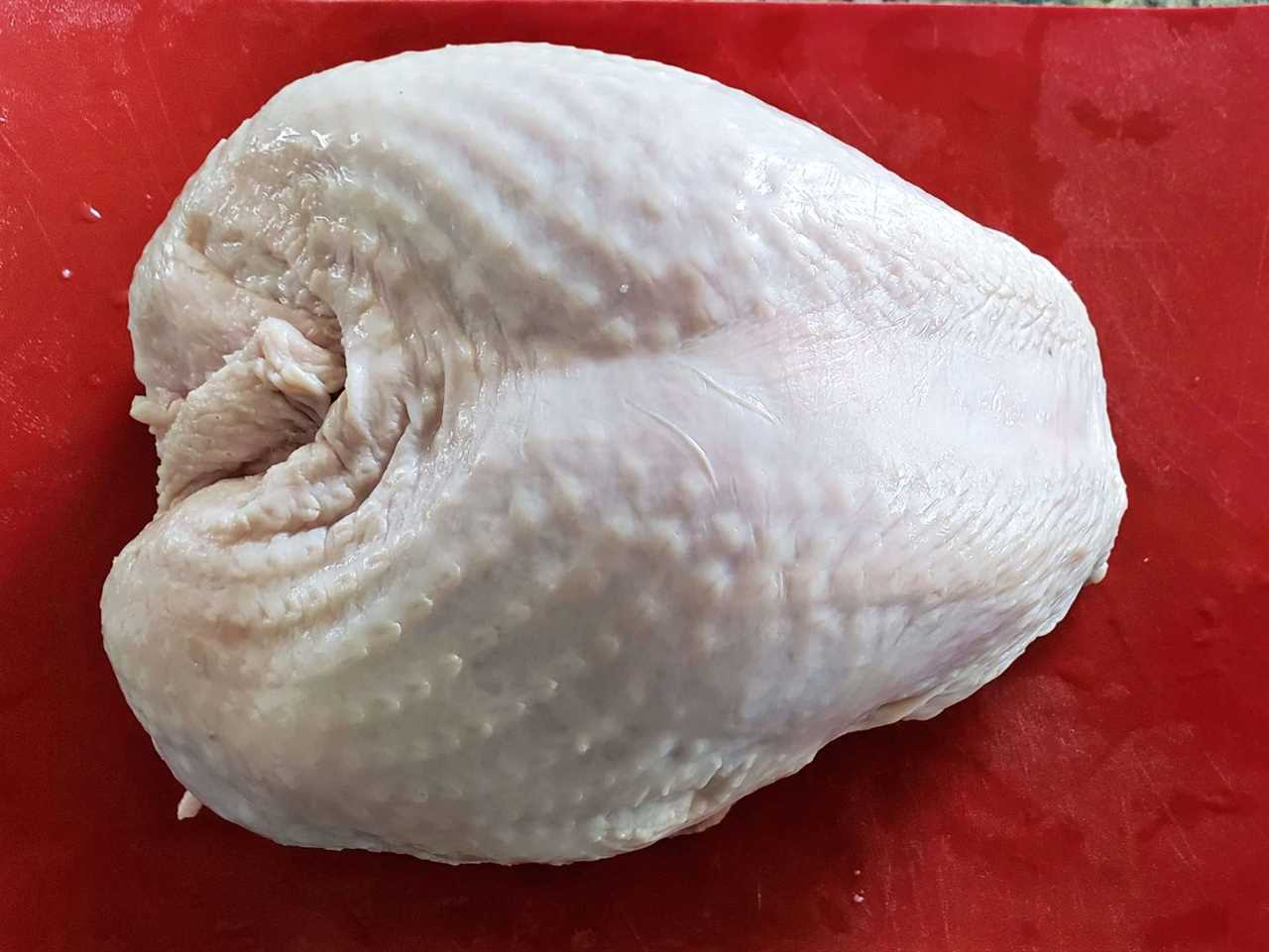 Raw whole turkey breast section