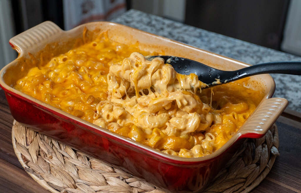 dish of smoked mac and cheese with spoon scoping some out