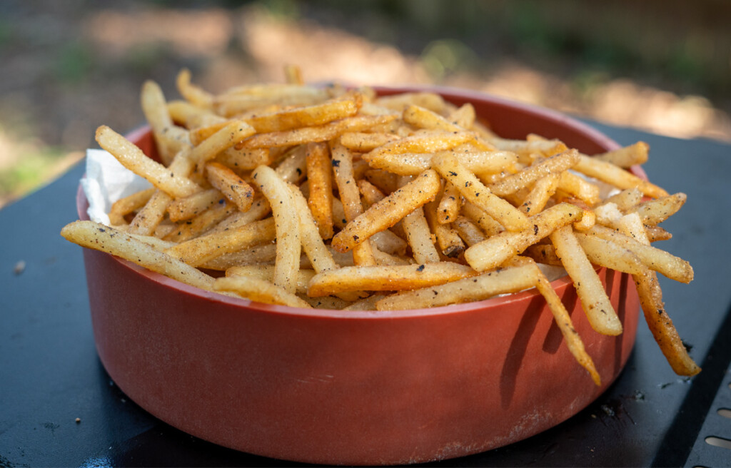 cooked french fries in a brown bowl