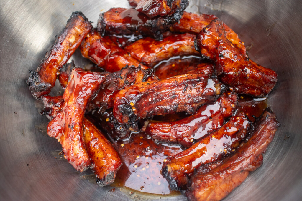 sauced party ribs in a metal bowl