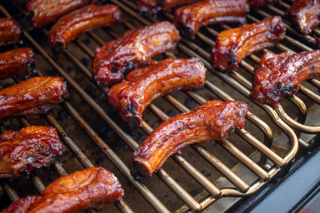 close up of cooked party ribs on the grill