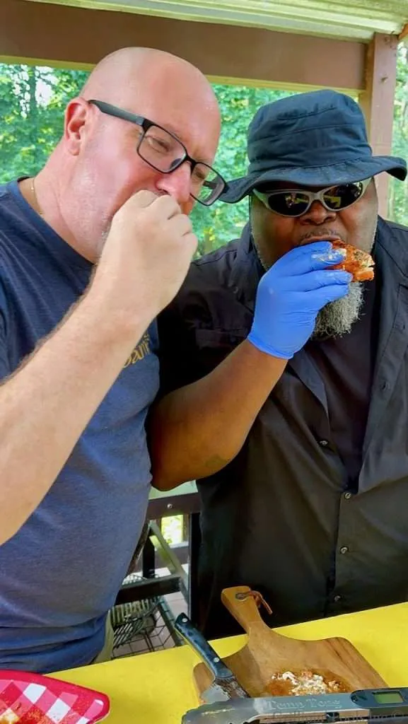 Scott Thomas and James Boatright eating Grilled Stuffed Pork Chops