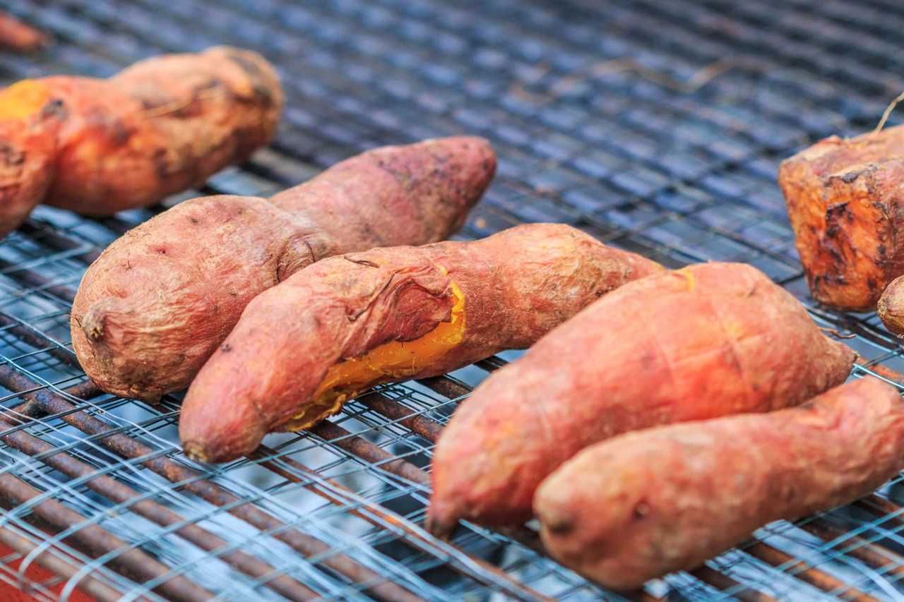 Sweet potatoes roasting on grill