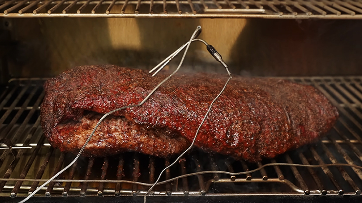 smoked brisket with two meat probes on a Pit Boss 1600 elite pellet smoker