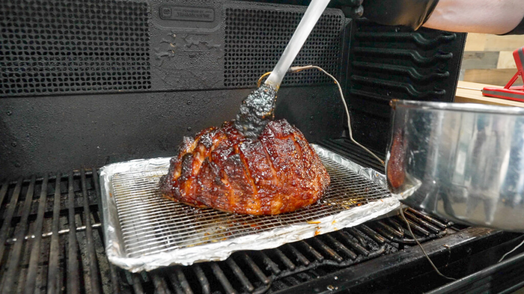 glazing a ham with a brush