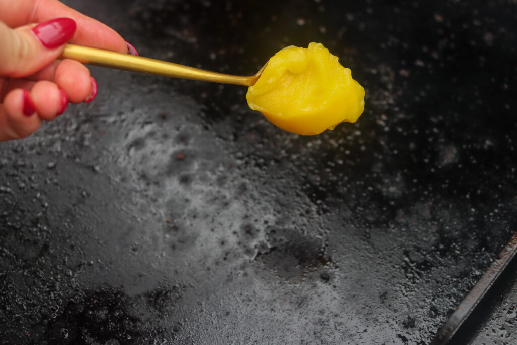 ghee being put on the griddle