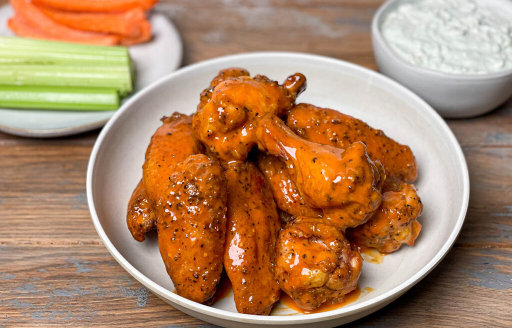 smoked buffalo wings on a white plate