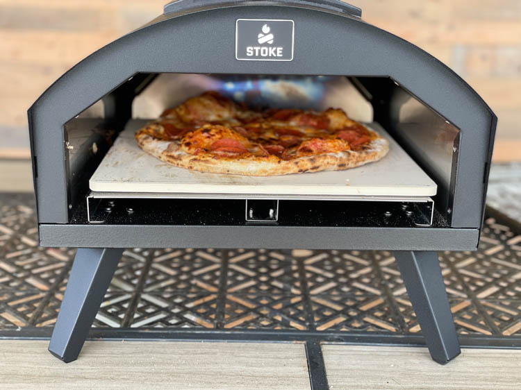 pizza cooking inside the Stoke pizza oven