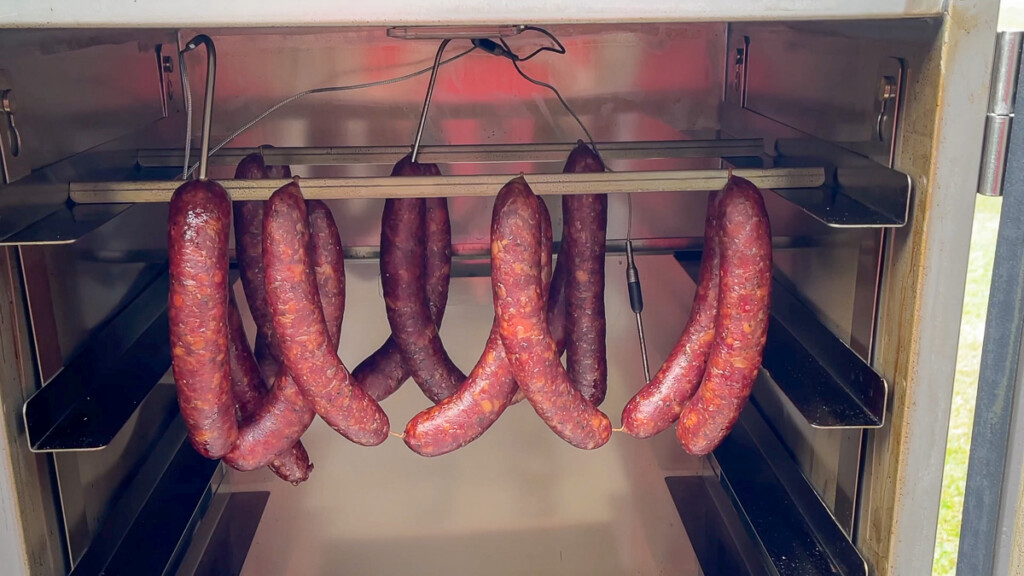 smoked texas hot guts in the smoker