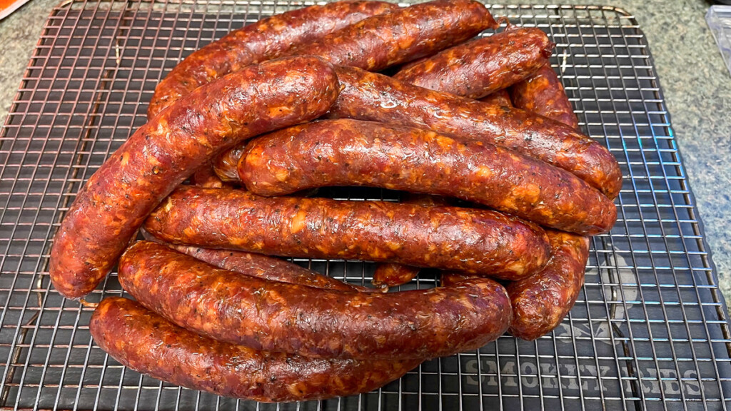 smoked texas hot gut sausages on a rack blooming