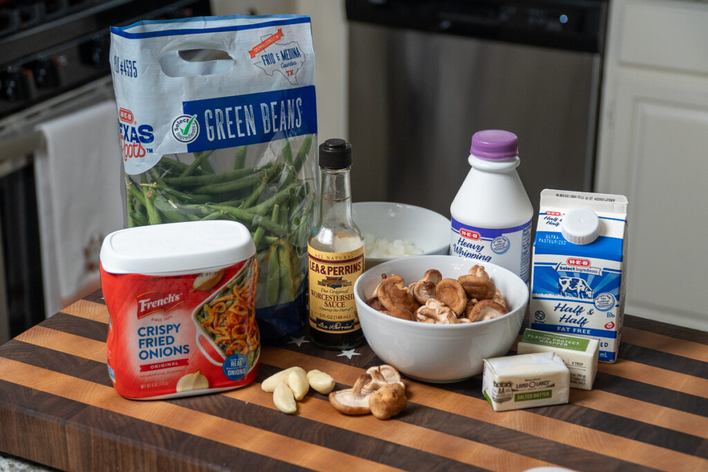 green bean casserole ingredients on a wooden chopping board