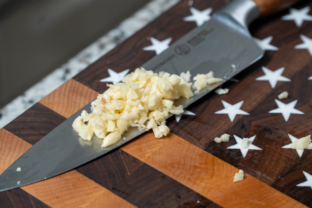 chopped garlic on a knife