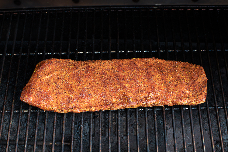 raw frozen seasoned pork rib in smoker