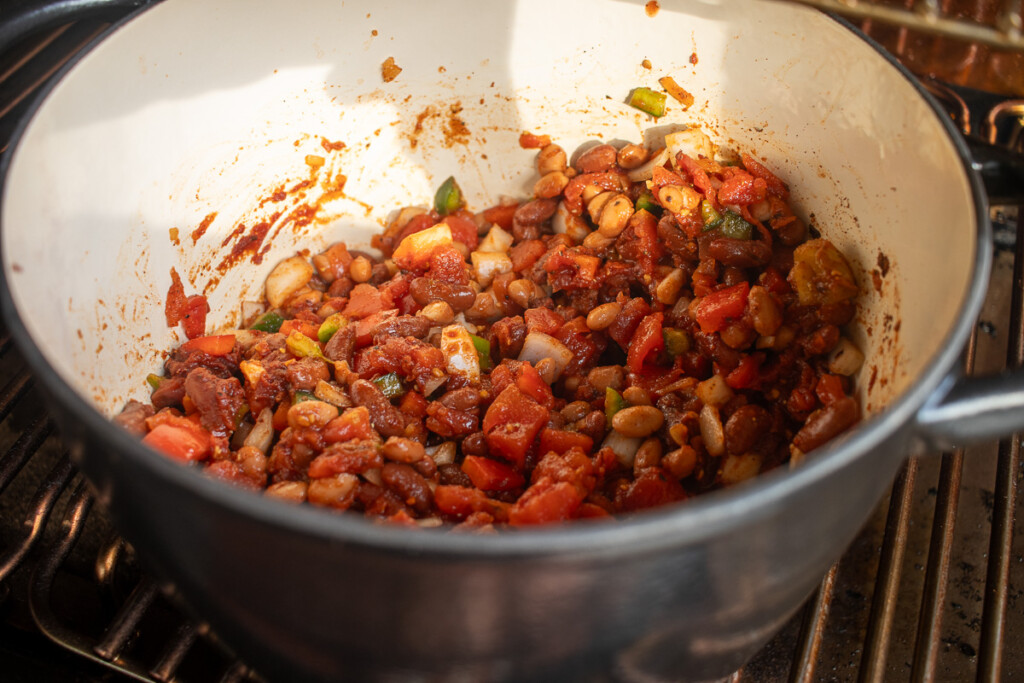 diced veges and tomato paste in a pot