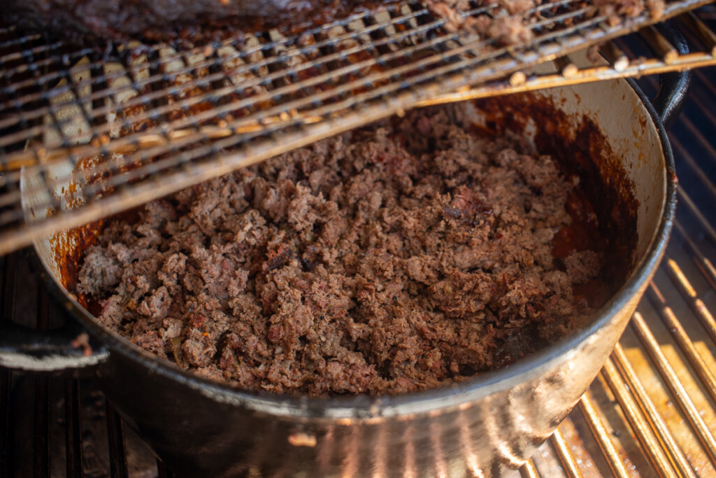 ground beef on top of chili ingredients