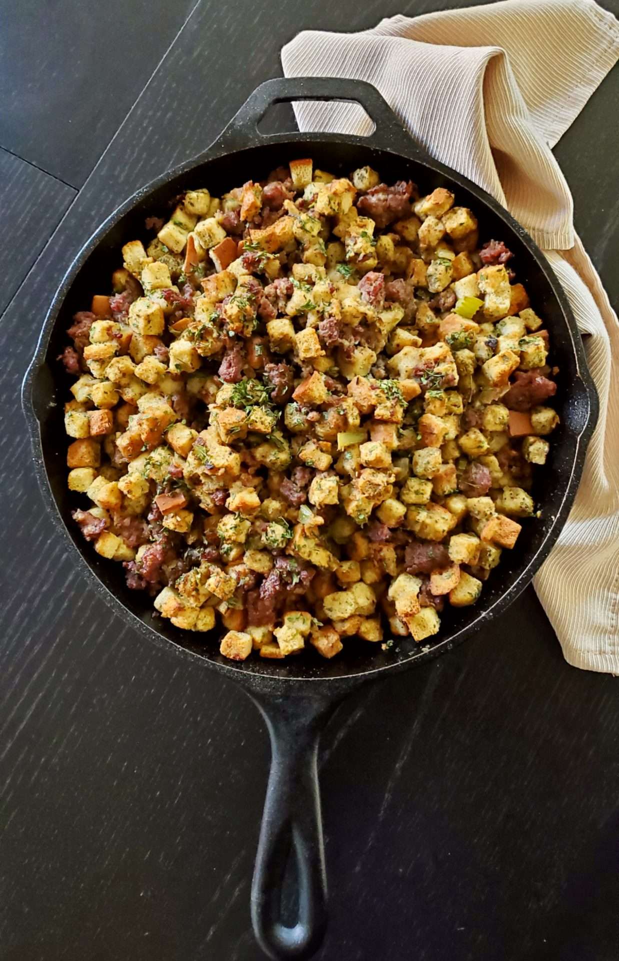 Cooked stuffing in a cast-iron skillet on the table