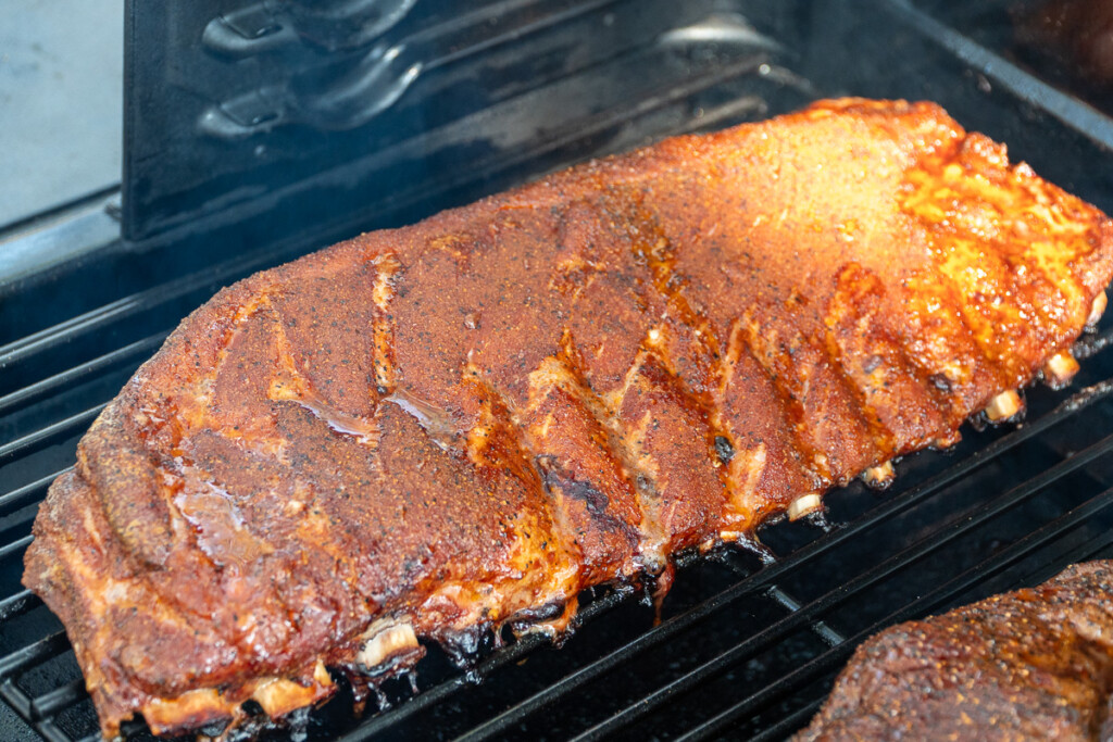 a cooked rack of ribs in the smoker